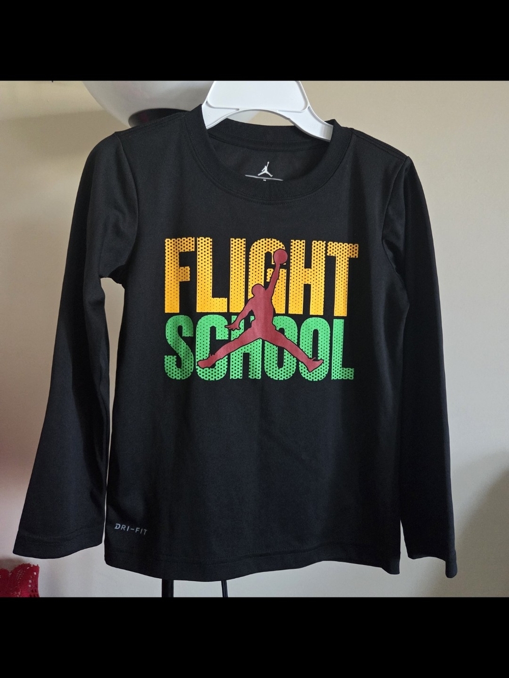 Size 6 Y.Black Long-Sleeve 'Flight School' Tee with Yellow, Green & Red Graphic.